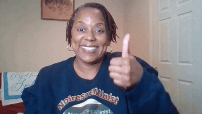 Woman in Noire Feminist Sweatshirt Thumbs Up
