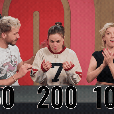 Woman In Number 7 Sweater In Front Of 0 200 10 Sign GIF