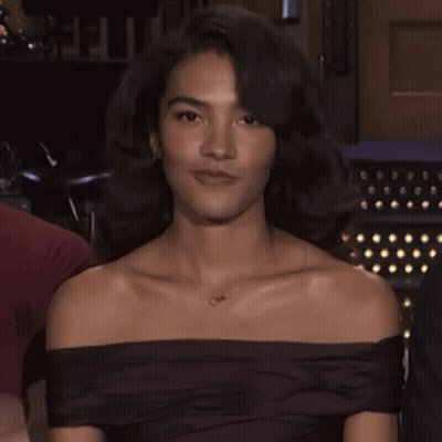 Woman In Off-Shoulder Top With O Necklace GIF