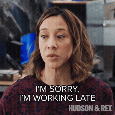 Woman In Office Says I'm Sorry I'm Working Late GIF