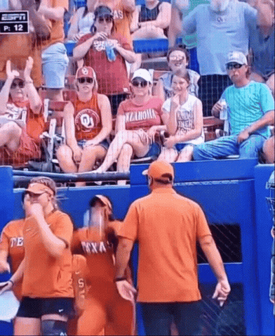 Woman In Oklahoma Shirt Standing In Stands GIF