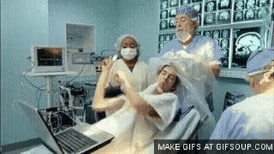 Woman In Operating Room With Laptop GIF