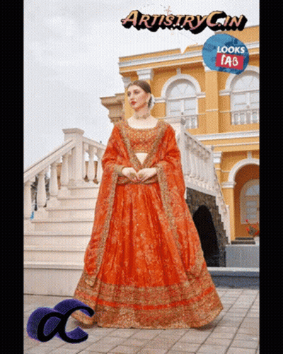 Woman In Orange Dress In Front Of Building Artistry Gin Looks Tab GIF