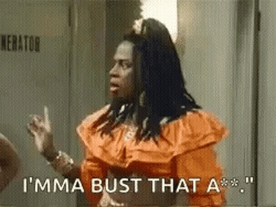 Woman In Orange Dress Saying I'ma Bust That A** GIF