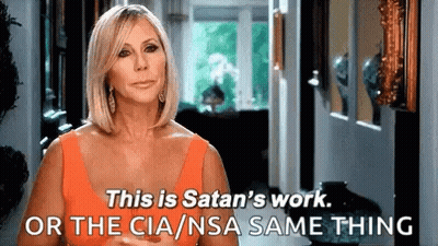 Woman In Orange Dress Saying This Is Satan's Work GIF