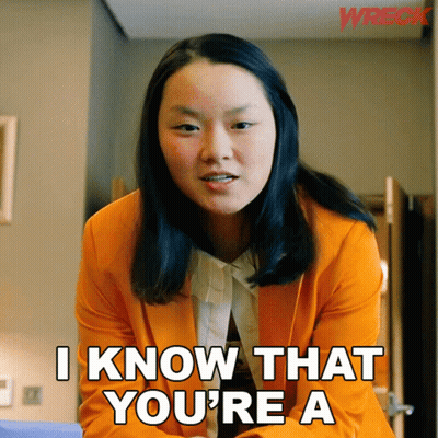Woman In Orange Jacket Says I Know That You're A GIF