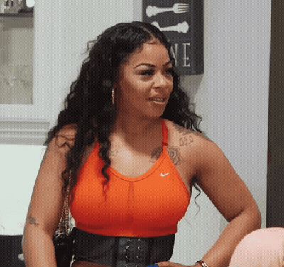 Woman In Orange Nike Tank Top Saying One GIF