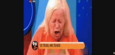 Woman In Orange Shirt Crying On TV GIF