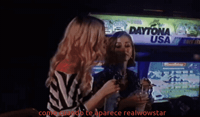 Woman In Orange Shirt Pouring Drink Into Glass GIF