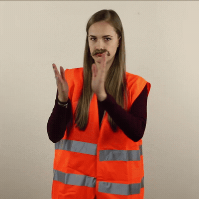 Woman In Orange Vest Clapping GIF