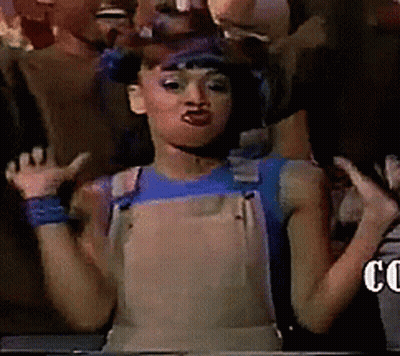 Woman In Overalls And Blue Shirt With Group GIF