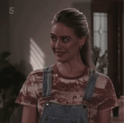 Woman In Overalls And Number 5 Shirt GIF