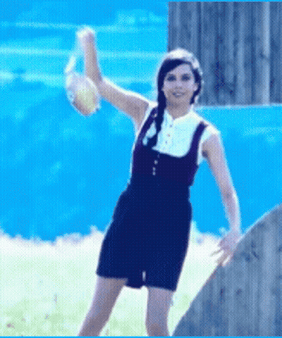 Woman In Overalls Throwing Ball GIF