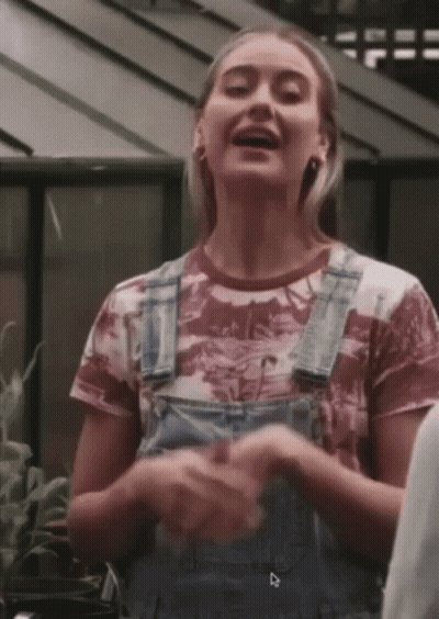 Woman In Overalls With Dinosaur T-Shirt GIF