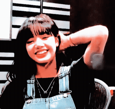 Woman In Overalls With H Necklace GIF