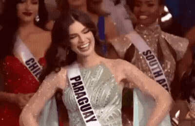 Woman In Paraguay Sash Smiling With Others GIF