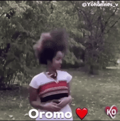 Woman In Park With Red Heart Saying Oromo GIF
