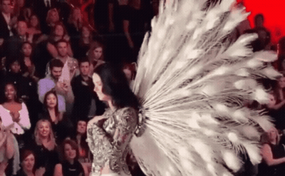 Woman In Peacock Costume Walking GIF