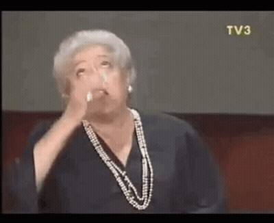 Woman In Pearl Necklace Making Face GIF