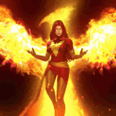 Woman In Phoenix Costume In Front Of Wall Of Fire GIF