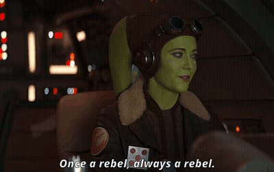 Woman In Pilot Helmet Saying Once A Rebel Always A Rebel GIF