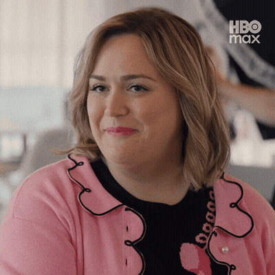 Woman In Pink And Black Sweater With Heart And HBO Max Logo GIF