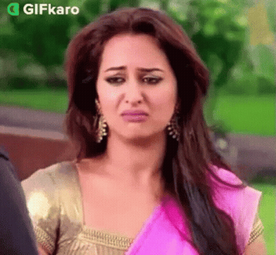 Woman In Pink And Gold Saree Making Funny Face GIF