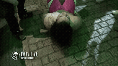 Woman In Pink And Green Outfit Laying On Ground Jwtv Live GIF