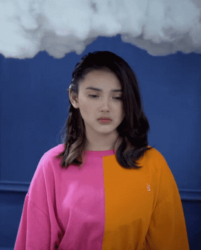 Woman In Pink And Orange Sweater With Letter S GIF
