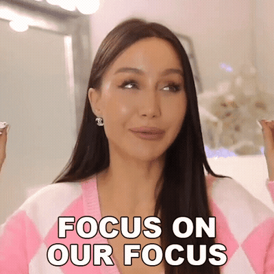 Woman In Pink And White Sweater Saying Focus On Our Focus GIF
