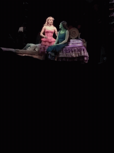 Woman In Pink Beside Woman In Blue GIF