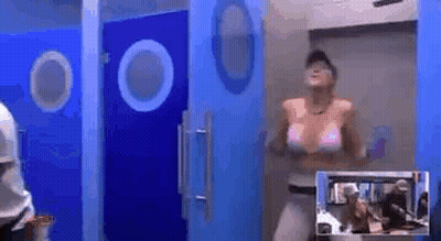 Woman in Pink Bikini Dancing in Bathroom With Blue Doors