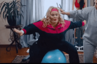 Woman In Pink Blue Jacket On Blue Ball GIF