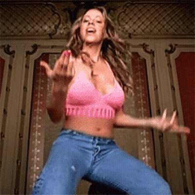 Woman In Pink Bra And Blue Jeans Dancing GIF