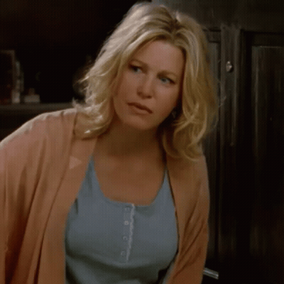 Woman In Pink Cardigan And Blue Tank Top GIF
