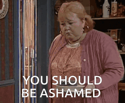 Woman In Pink Cardigan Saying You Should Be Shamed GIF