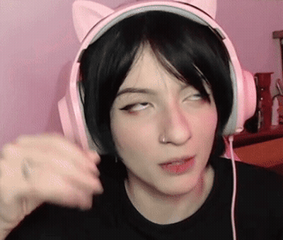 Woman in Pink Cat Ear Headphones Making a Face