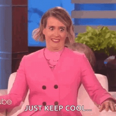 Woman In Pink Coat Making Funny Face GIF