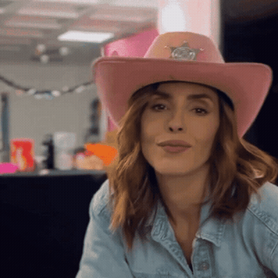 Woman In Pink Cowboy Hat And Denim Shirt GIF