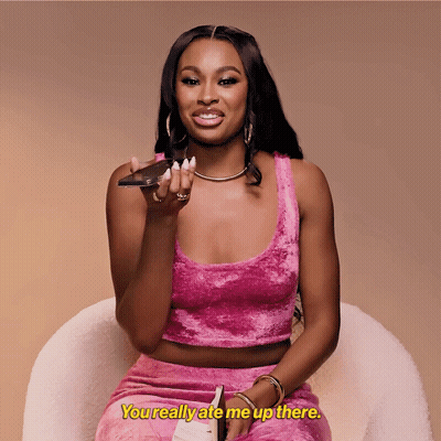 Woman In Pink Crop Top And Skirt Saying You Ate Me Up GIF