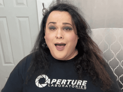 Woman In Pink Crop Top With Man's Face On Her Face GIF