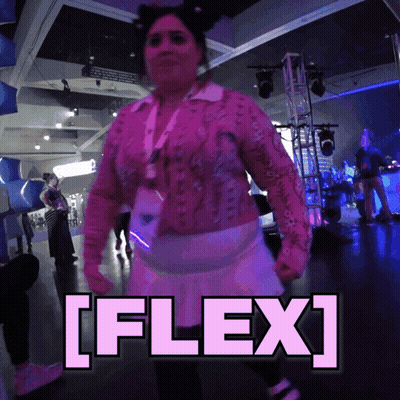 Woman In Pink Dancing With Flex Sign GIF