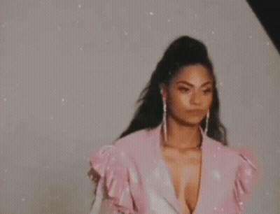 Woman In Pink Dress And Earrings GIF