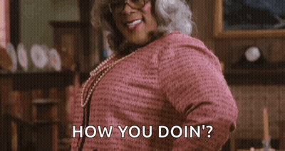 Woman In Pink Dress And Glasses Asking How You Doin GIF