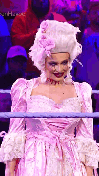 Woman in Pink Dress and Wig in Boxing Ring