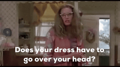 Woman In Pink Dress Asking Does Your Dress Have To Go Over Your Head GIF