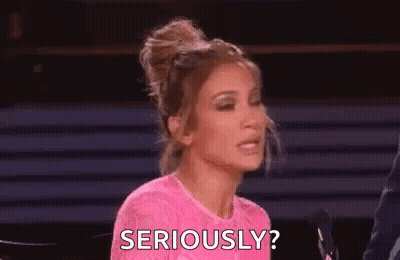 Woman in Pink Dress Asking Seriously