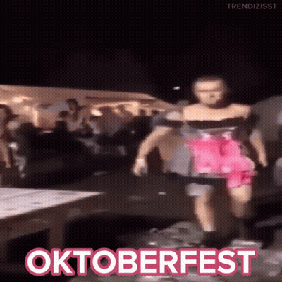 Woman In Pink Dress Dancing At Oktoberfest GIF