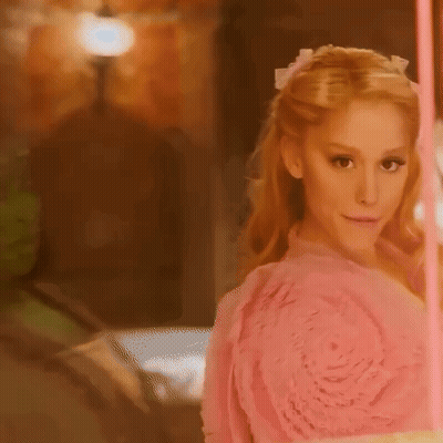 Woman In Pink Dress Facing Mirror GIF