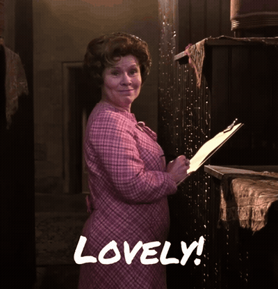 Woman In Pink Dress Holding Clipboard Saying Lovely GIF